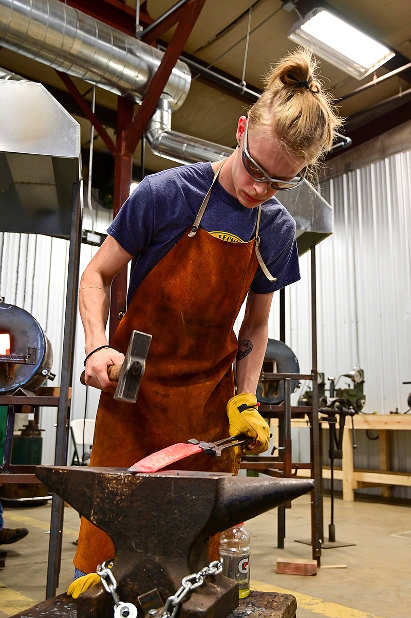 Clayton Martin hammers on a chef's knife fresh from the forge at the B.R. Hughes Classroom at Texarkana College's Bill Moran School of Bladesmithing on Friday in Texarkana, Texas. 