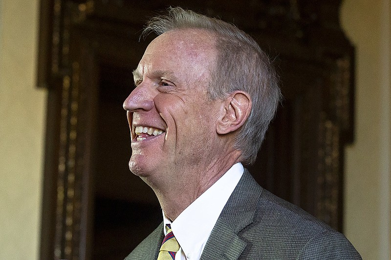 FILE - In this Jan. 8, 2019 file photo, now former, Illinois Gov. Bruce Rauner speaks during a press conference in his office at the Capitol, in Springfield, Ill. Illinois' top leaders trumpeted the benefits of automatic voter registration when signing a 2017 bipartisan effort into law: more civic participation, fewer barriers to the ballot box and modernized systems. But the state hasn't lived up to its promise with a rollout that's behind schedule and several state agencies struggling to get on board. (Rich Saal/The State Journal-Register via AP File)