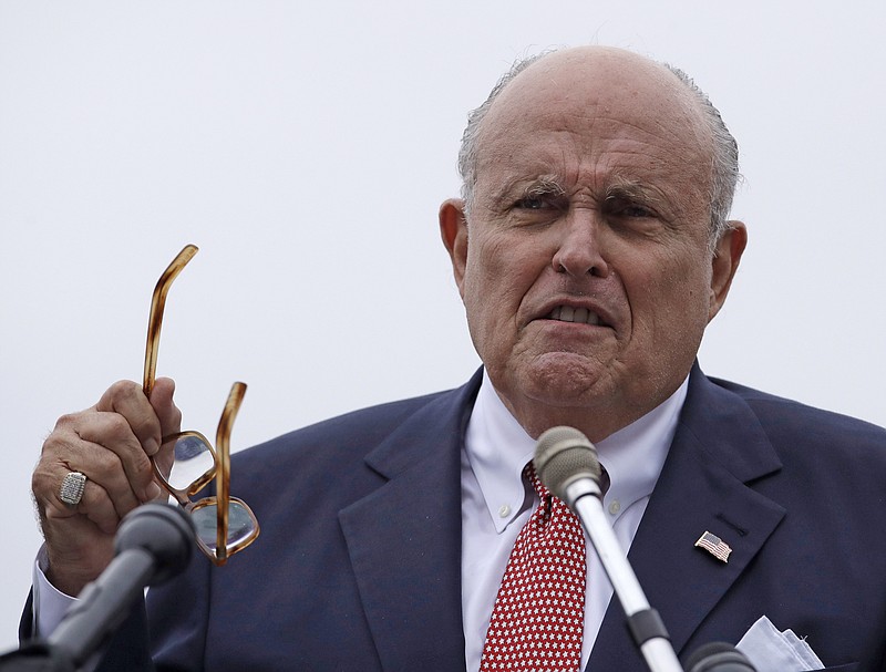 FILE - In this Aug. 1, 2018, file photo, Rudy Giuliani, an attorney for President Donald Trump, speaks in Portsmouth, N.H. President Donald Trump on Saturday, Oct. 12, 2019, stood behind personal attorney Giuliani, one of his highest-profile and most vocal defenders, amid reports that federal prosecutors in the city Giuliani led as mayor are eyeing him for possible lobbying violations. (AP Photo/Charles Krupa, File)