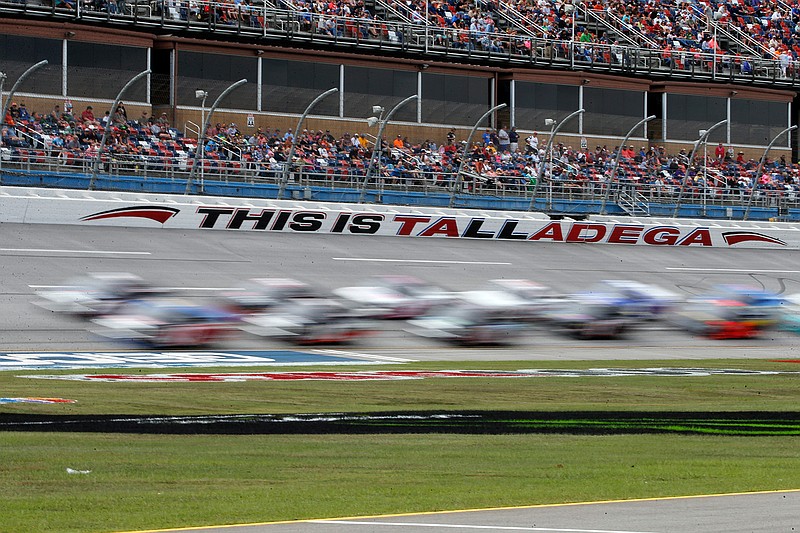 Trucks pass through the tai-oval during the Sugarlands Shine 250 at Talladega Superspeedway, Saturday, Oct 12, 2019, in Talladega, Ala. (AP Photo/Butch Dill)