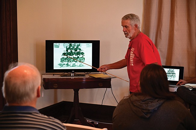 Eddie Ray Shuffield speaks Saturday about the history of the rivalry of Arkansas High School and Texas High School during a presentation titled "Before They Were Razorbacks" at the P.J. Ahern House in Texarkana, Ark. 