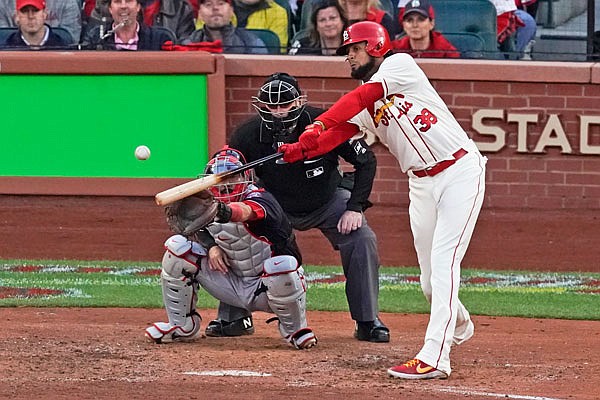 Jose Martinez of the Cardinals hits an RBI double during the eighth inning Saturday in Game 2 of the National League Championship Series against the Nationals at Busch Stadium in St. Louis.