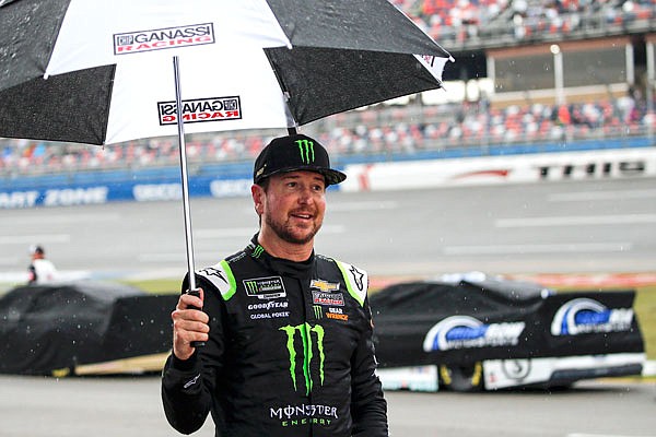 Kurt Busch walks back to the garage during a rain delay Sunday at a NASCAR Cup Series race at Talladega Superspeedway in Talladega, Ala.