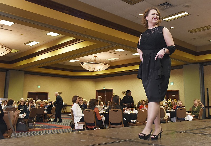 <p>Julie Smith/News Tribune</p><p>Shay Wahl, one of the volunteer models at the 2017 Strut Your Style Luncheon and Fashion Show, moves across the runway in a satin face chiffon dress from Ana Marie Bridal in downtown Jefferson City. This year’s event is set for Oct. 28 at the Capitol Plaza Hotel and Convention Center.</p>