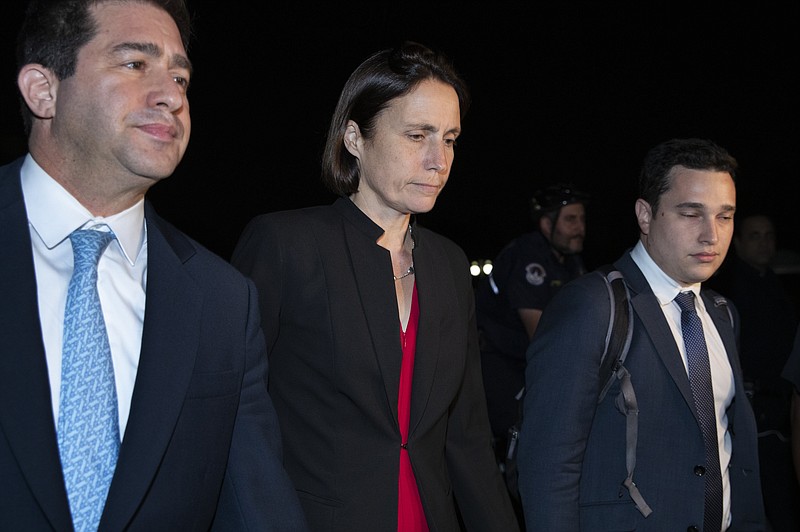Former White House advisor on Russia, Fiona Hill, center, leaves Capitol Hill in Washington, Monday, Oct. 14, 2019, after testifying before congressional lawmakers as part of the House impeachment inquiry into President Donald Trump. (AP Photo/Manuel Balce Ceneta)