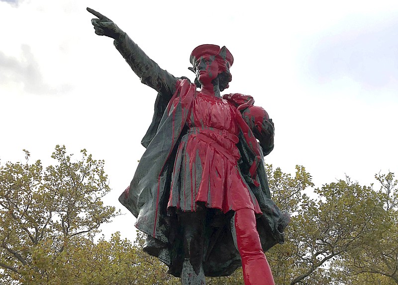 Red paint covers a statue of Christopher Columbus on Monday, Oct. 14, 2019, in Providence, R.I., after it was vandalized on the day named to honor him as one of the first Europeans to reach the New World. The statue has been the target of vandals on Columbus Day in the past. (AP Photo/Michelle R. Smith)