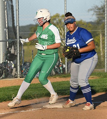 Kathleen Groner of Blair Oaks is safe at third, just beating the throw to Bryanna Jones of Boonville during Monday's game in Wardsville.