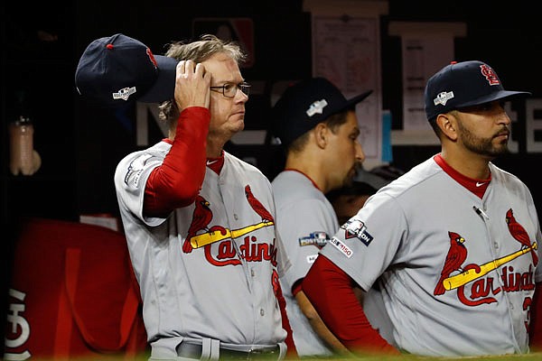 Cardinals manager Mike Shildt scratches his head during the eighth inning of Monday night's Game 3 of the National League Championship Series against the Nationals in Washington.