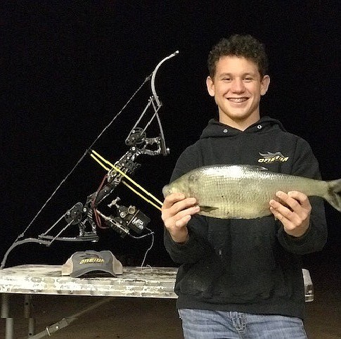 Jacob Morgan, of Rogersville, caught a state-record gizzard shad using an alternative method. Morgan's fish, weighing in at 2 pounds, 13 ounces, was shot June 6 on Bull Creek.