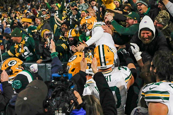 Packers kicker Mason Crosby celebrates after kicking the game-winning field goal by jumping in the stands following Monday night's game against the Lions in Green Bay, Wis. Green Bay won 23-22.