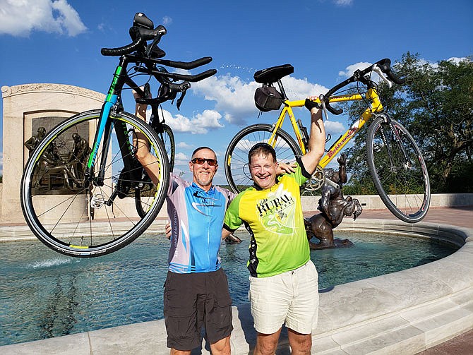 Alan Marrs, of Ashland, and Buck Brooks, of Holts Summit, pose with their bicycles Sunday near the Capitol after having biked from Columbia. The two were expected to arrive by bicycle tonight in Nashville, Illinois, on their journey to attend three University of Missouri road games in a four-week span.