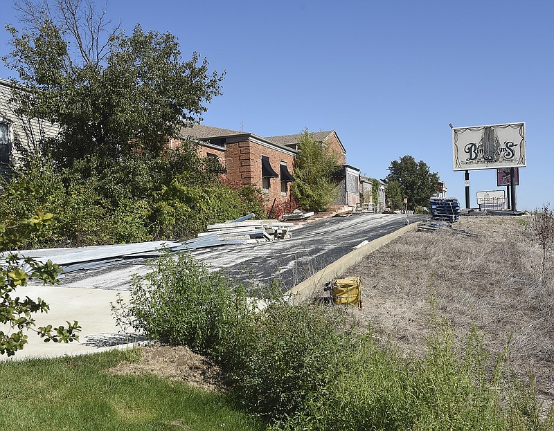 The old Truman Hotel on Jefferson Street could soon be demolished, but plans to construct a second hotel on the property are being delayed. 