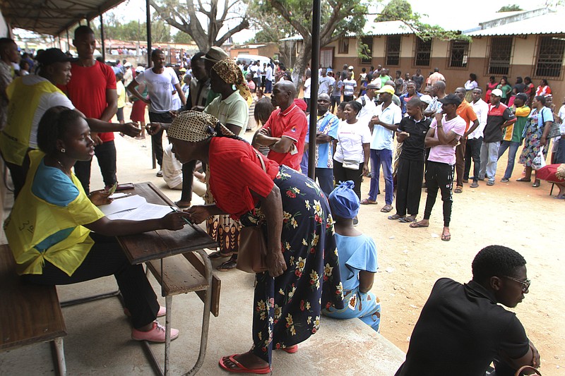 Voters queue to cast their votes in Maputo, Mozambique, Tuesday, Oct. 15, 2019 in the country's presidential, parliamentary and provincial elections. Polling stations opened across the country with 13 million voters registered to cast ballots in elections seen as key to consolidating peace in the southern African nation. (AP Photo/Ferhat Momade)