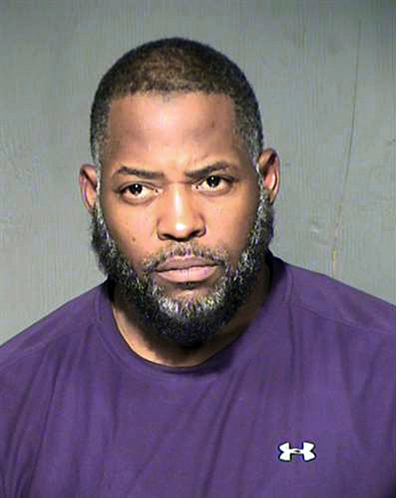 FILE - This undated file photo provided by the Maricopa County Sheriff's Department shows Abdul Malik Abdul Kareem, a Phoenix man who was convicted of providing guns to two friends who launched a 2015 attack on a Prophet Muhammad cartoon contest in suburban Dallas. A court hearing Tuesday, Oct. 15, 2019, in Phoenix is focusing on the FBI's failure to disclose surveillance video taken of the two friends of Kareem's on the day before they left Arizona to launch the attack in Garland. Kareem claims the video would have helped his defense. (Maricopa County Sheriff's Department via AP, File)