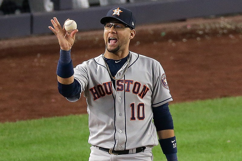 Houston Astros first baseman Yuli Gurriel (10) reacts after making the play at first for the third out to end Game 3 of baseball's American League Championship Series against the New York Yankees, Tuesday, Oct. 15, 2019, in New York. The Astros won 4-1.(AP Photo/Seth Wenig)