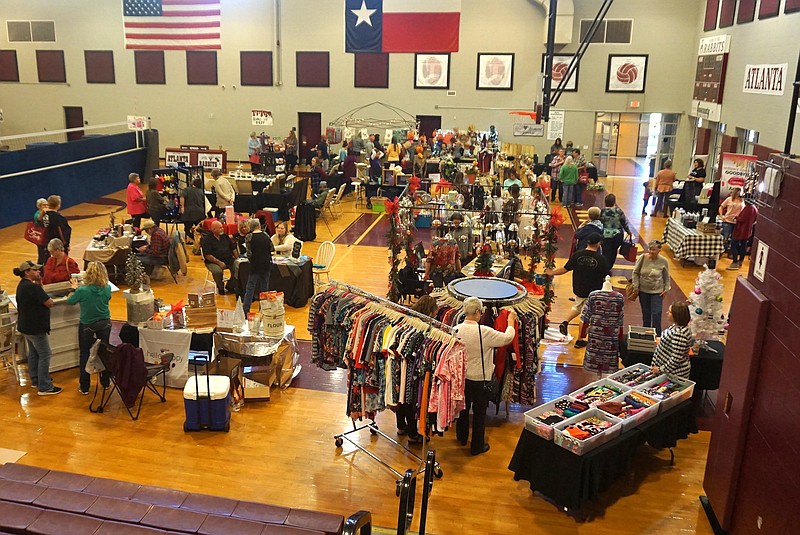 The gymnasium of the Atlanta Middle School is full of shoppers and vendors for the third year of an Christmas in October, which  benefits the Child Protective Services.
