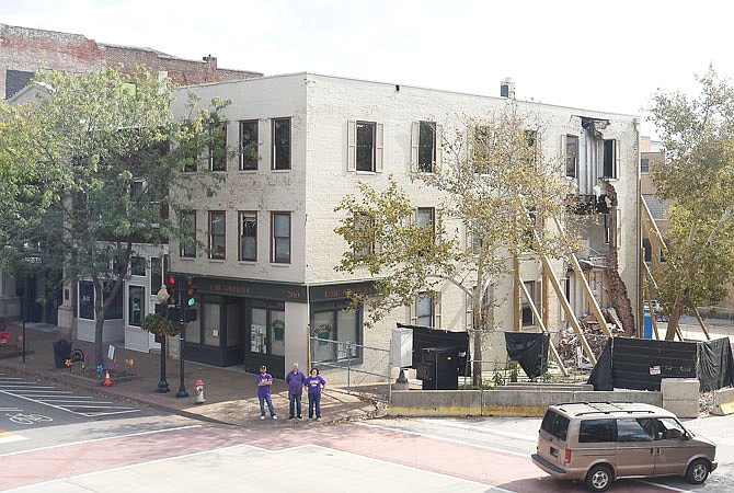 The buildings at 200 and 202 E. High. St. sit in October as decisions are made about what to do with the crumbling building and it's neighbor.