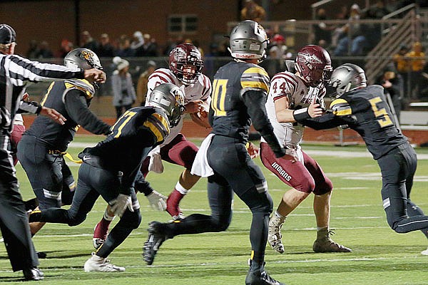 Drew Edwards of School of the Osage follows the block of teammate James Hutchcraft (44) during last Friday night's game against Versailles. 
