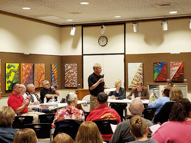 Operation Bugle Boy President Chris Jarboe talks to the crowd gathered Thursday night for The Price of Freedom: Our Wounded Warriors at the Missouri River Regional Library. The seminar, sponsored by Operation Bugle Boy, the library and Friends of the Missouri River Regional Library, brought several veterans together to tell residents about their experiences while serving in the military.