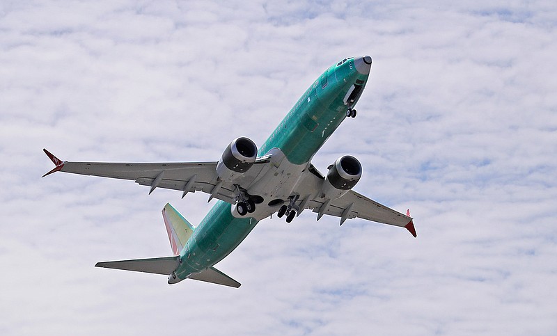 In this May 8, 2019, file photo a Boeing 737 MAX 8 jetliner being built for Turkish Airlines takes off on a test flight in Renton, Wash. Passengers who refuse to fly on a Boeing Max won't be entitled to compensation if they cancel. However, travel experts think airlines will be very flexible in rebooking passengers of giving them refunds if they're afraid to fly on a plane that has crashed twice. (AP Photo/Ted S. Warren, File)