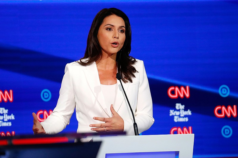 Democratic presidential candidate Rep. Tulsi Gabbard, D-Hawaii, participates in a Democratic presidential primary debate hosted by CNN/New York Times at Otterbein University, Tuesday, Oct. 15, 2019, in Westerville, Ohio. (AP Photo/John Minchillo)