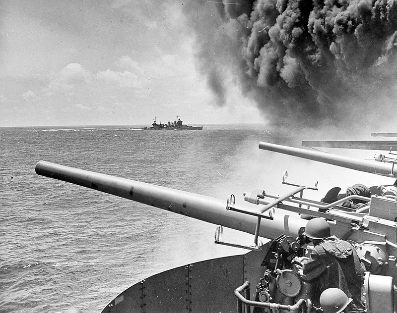  In this June 4, 1942 file photo provided by the U.S. Navy the USS Astoria (CA-34) steams by USS Yorktown (CV-5), shortly after the carrier had been hit by three Japanese bombs in the battle of Midway. Researchers scouring the world's oceans for sunken World War II ships are honing in on debris fields deep in the Pacific. A research vessel called the Petrel is launching underwater robots about halfway between the U.S. and Japan in search of warships from the Battle of Midway. (William G. Roy/U.S. Navy via AP, File)