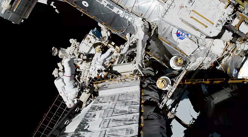 In this photo provided by NASA astronauts Christina Koch and Jessica Meir exits the International Space Station on Friday, Oct. 18, 2019.  The world's first female spacewalking team is making history high above Earth.  This is the first time in a half-century of spacewalking that a woman floated out without a male crewmate. Their job is to fix a broken part of the station's solar power network.(NASA via AP)