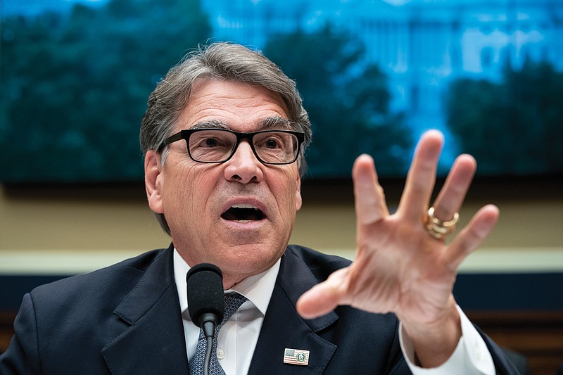 In this May 9, 2019, file photo, Energy Secretary Rick Perry testifies before the House Energy and Commerce Committee on his future budget request, on Capitol Hill in Washington. Long after more flamboyant Cabinet colleagues fell out of President Donald Trump's favor amid ethics scandals, low-profile Perry, the folksy former Texas governor, survived in part by steering clear of controversy as energy secretary.  (AP Photo/J. Scott Applewhite, File )