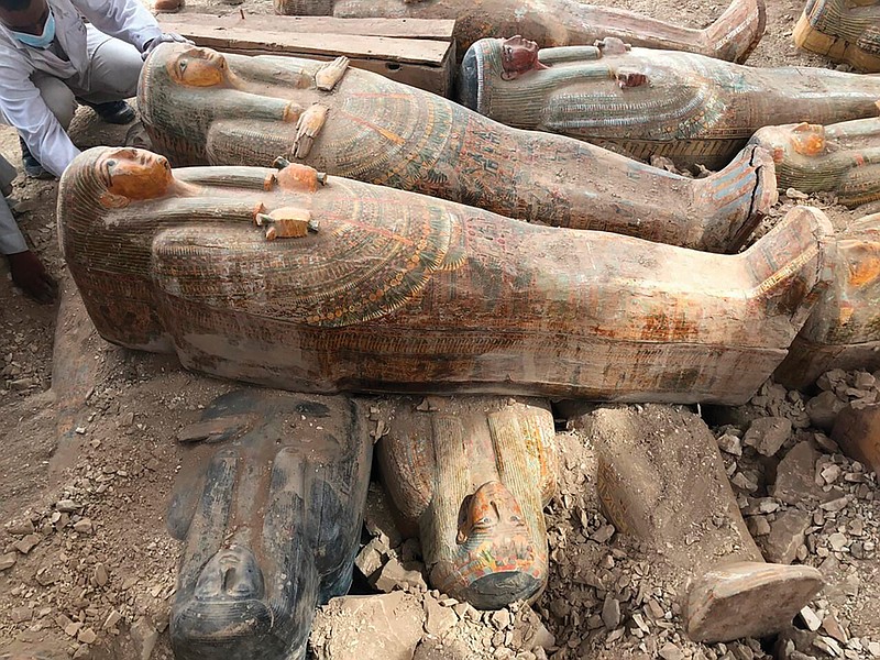 This Tuesday, Oct. 15, 2019 file photo provided by the Egyptian Ministry of Antiquities shows recently discovered ancient colored coffins with inscriptions and paintings, in the southern city of Luxor, Egypt. (Egyptian Ministry of Antiquities via AP)