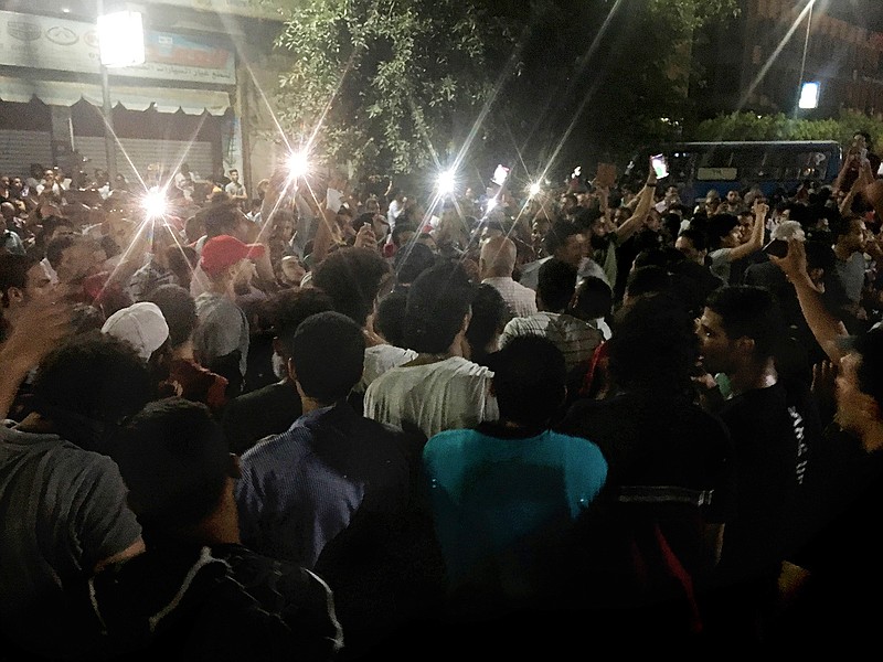 In this Sept. 21, 2019 file photo, protesters chant slogans against the regime in Cairo, Egypt. Egyptian authorities released more than 100 people who were among hundreds more arrested in a sweeping crackdown following small but rare anti-government protests last month, rights lawyers and officials said Saturday, Oct. 19. Lawyers Mustafa el-Demiry and Khaled Ali said 101 detainees, including 30 women, were released late Friday, pending an investigation into allegations they took part in the activities of a banned group and disseminating false news on social media platforms.  (AP Photo/Nariman El-Mofty, File)