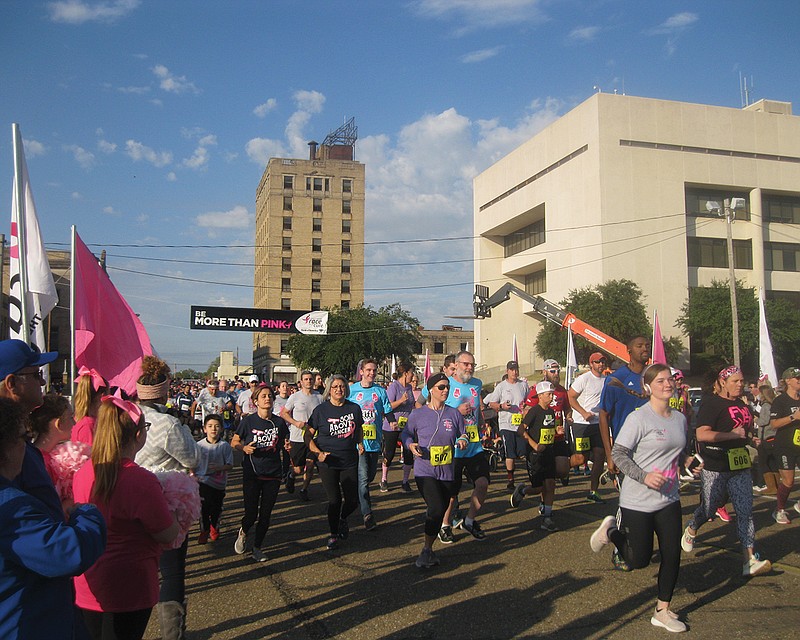 Breast cancer survivors, along with thousands of their supporters, packed together Saturday along Front Street in downtown Texarkana for the 21st annual Susan G. Komen Race for the Cure.
