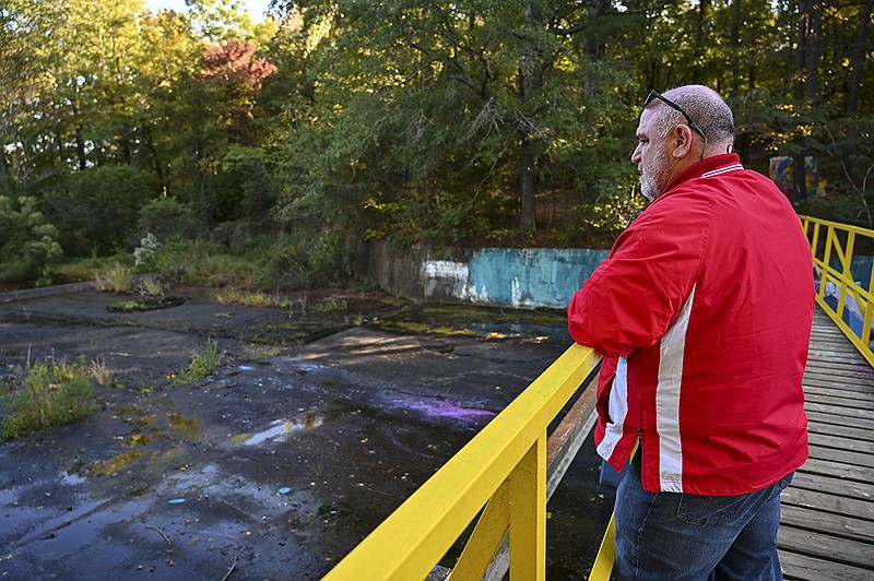 Texarkana, Texas, Parks and Recreation Director Robby Robertson looks out over the Bringle spillway bridge where paint cans that were being used for the Bringle Lake Art Park had been knocked over, leaving the concrete stained with splattered paint, on Tuesday, Oct. 22, 2019, in Texarkana, Texas. 