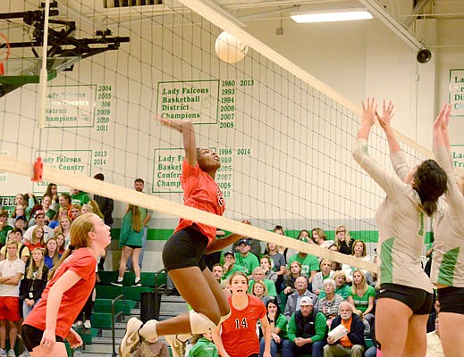 Rhakala Blackmon of Jefferson City spikes the ball during Tuesday night's match against Blair Oaks in Wardsville.