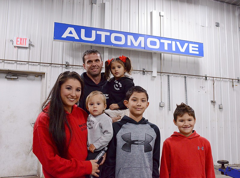 Sally Ince/ News Tribune  
Josh Lehmen stands with his wife Alicia, and children Lincoln, Gwendolyn, Theodore and Calvin on October 31, 2019 at his new automotive location. Lehmen owns On-Site Oil Change but will be changing his business name to Lehmen Automotive at the new location. 