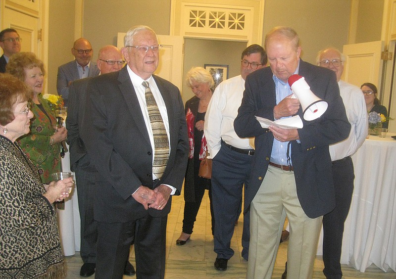 Local attorney John Greer speaks with the help of a megaphone Wednesday at the Regional Arts Center during a public farewell reception for retired Bowie County Judge James Carlow and his wife, Nancy. 
