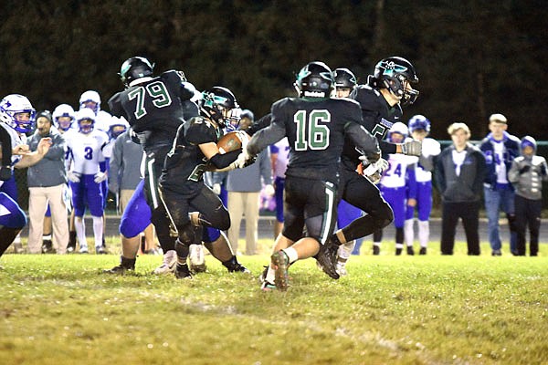 North Callaway junior running back Cody Cash follows a group of blockers during the Thunderbirds' 28-22 conference victory earlier this month against Montgomery County in Kingdom City.