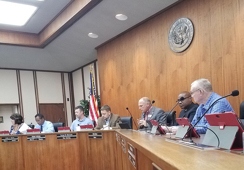 Texarkana, Ark., Mayor Allen Brown, third from right, city staff and members of the Board of Directors meet Thursday at City Hall. The Board voted to accept a loan agreement that will provide $885,000 in funding for a new community and recreation center.