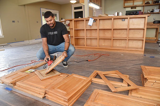 Darian Pruitt, who'll serve as program manager for the HALO boys' home, has been involved in the remodeling of the house to serve young men who need tutoring assistance and a positive and safe place to go after school.