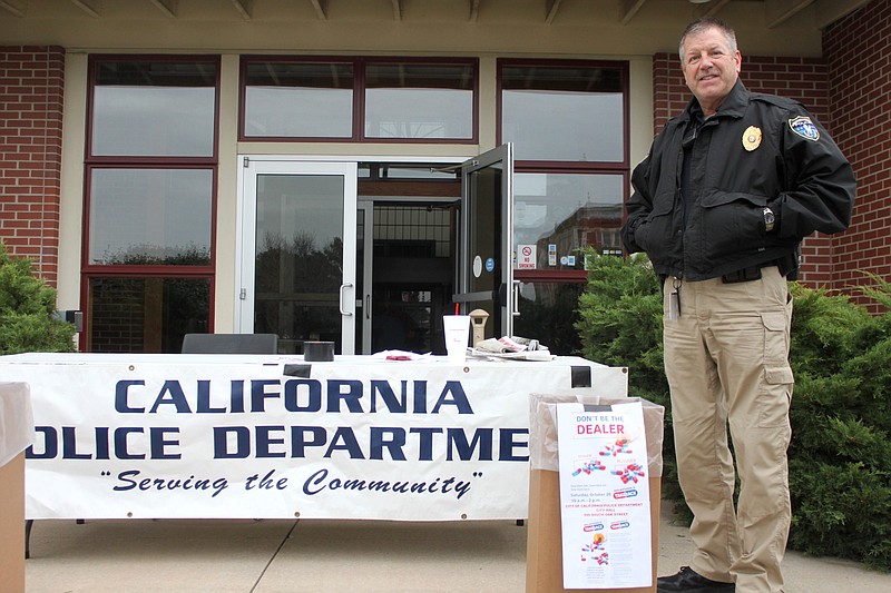 Officer Darrell Chute of the California Police Department braved the cold temperatures and helped the drug takeback program collect 105 pounds of medication, filling four boxes before the day's end.