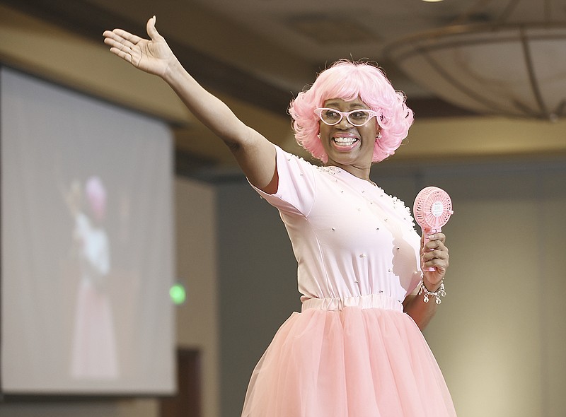 Dressed all in pink, Liz Morrow made a grand entrance Monday before the modeling show formally got underway. She was one of several models who all have one thing in common — they are breast cancer survivors. They were part of the Strut Your Style Fashion Show and Luncheon on Monday at Capitol Plaza Hotel.