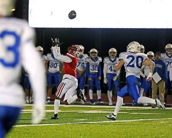 Jefferson City wide receiver Devin White tries to make a catch in front of Rockhurst's Wilson Selzer during last Friday's game at Adkins Stadium. 