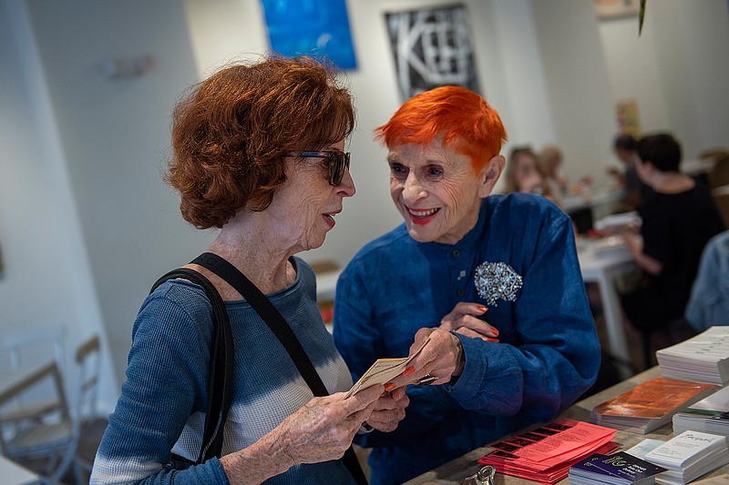 Tina Caruso, a 91-year-old hostess at Frieda's restaurant, talks with Sheila Kennedy, who is from Queen Village neighborhood in Philadelphia, at the restaurant in Philadelphia, Pa. on Oct. 1, 2019. (Baidi Wang/The Philadelphia Inquirer/TNS)