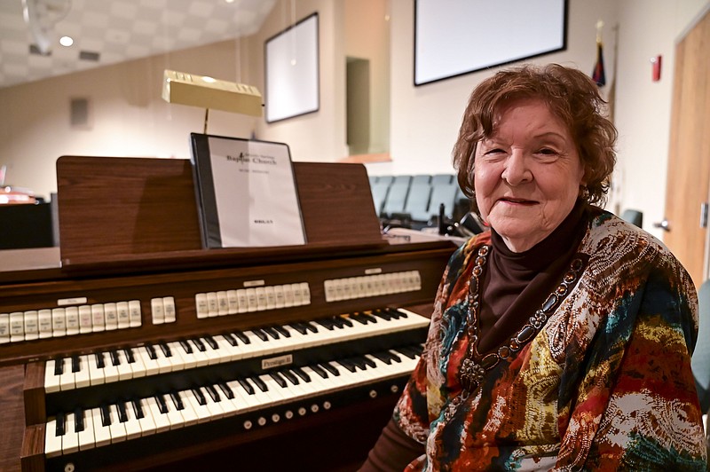 Bennie Fay Smith poses for a portrait Oct. 17 next to the organ she plays at Myrtle Springs Baptist Church in Hooks, Texas.
