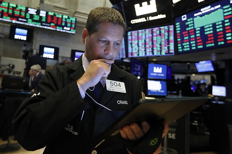 FILE - In this Monday, Oct. 28, 2019, file photo trader Craig Esposito works on the floor of the New York Stock Exchange. The U.S. stock market opens at 9:30 a.m. EDT on Thursday, Oct. 31. (AP Photo/Richard Drew, File)