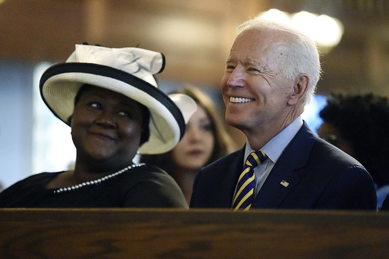 In this July 7, 2019 file photo, Democratic presidential candidate and former vice president Joe Biden attends a Sunday service at Morris Brown AME Church in Charleston, S.C. A Catholic priest in South Carolina denied communion to Joe Biden over the weekend, a decision purportedly made over the former vice president's stance on abortion. It illustrates the tricky challenge facing presidential candidates as they share their faith on the trail: How to balance the private and deeply personal values of their religions with a public campaign schedule that pushes them to authentically choose a side in polarizing moral debates? (AP Photo/Meg Kinnard, File)
