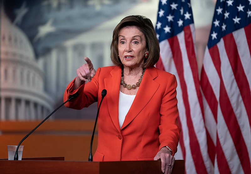 Speaker of the House Nancy Pelosi, D-Calif., talks to reporters on Thursday just before the House vote on a resolution to formalize the impeachment investigation of President Donald Trump. 