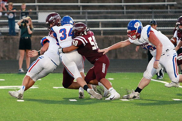 School of the Osage senior Rudy Escobar makes a tackle during a game earlier this season against California.