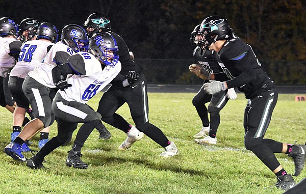 South Callaway offensive lineman Creed Farley sets up to block a North Callaway defender during the Bulldogs' 26-23 loss to the Thunderbirds last Friday in Kingdom City.