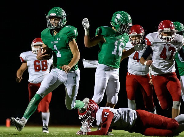 Blair Oaks quarterback Dylan Hair breaks into the open field and scampers for a touchdown during Friday night's game against St. James at the Falcon Athletic Complex in Wardsville.