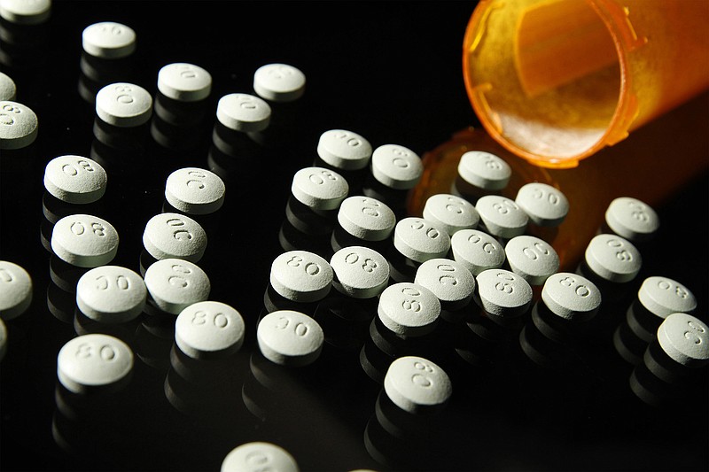 OxyContin, in 80 mg pills, in a 2013 file image. Doctors who receive gifts and payments from opioid manufacturers are more likely to prescribe higher amounts of opioid painkillers than their colleagues, according to researchers. (Liz O. Baylen/Los Angeles Times/TNS) 